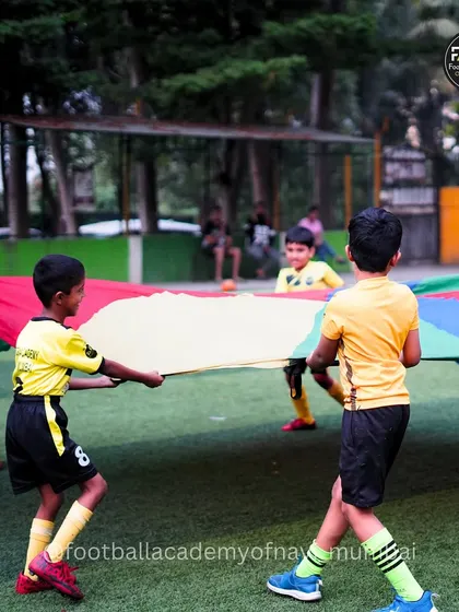 It's not all just drills and matches. Building team spirit and having fun is a huge part of my philosophy. Moments like these, with our parachute game, create bonds and memories that last.