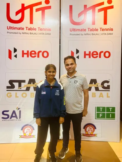 Our player Swara Jangade standing with her coach before competing at the Cadet & Sub-Junior National Championship in Indore, where she was selected to represent the Maharashtra U-15 girls' team.