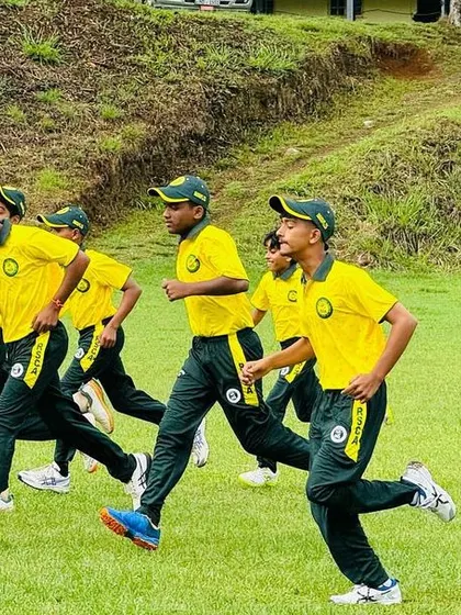 Players perform running drills as part of their warm-up in the cool Sri Lankan climate.