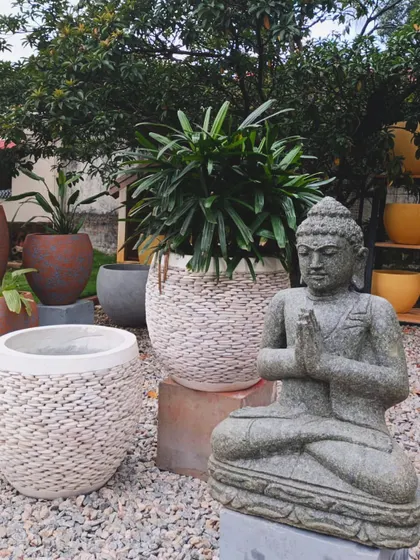 My Balinese pebble planters are the ultimate garden accents, shown here with a serene Buddha statue.