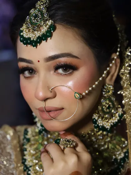 A portrait of our model from the beauty expo. The makeup is flawless, with a strong highlight and a nude lip to balance the dramatic eyes.