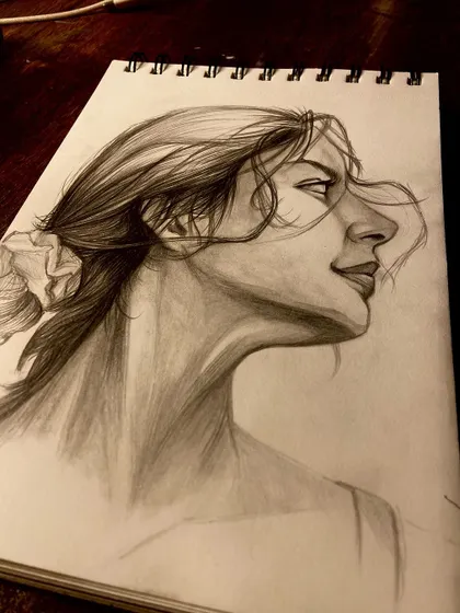 A side view of the profile sketch, showing the movement and texture of the hair.