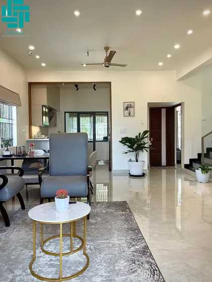 The high ceilings and large windows make this living room feel bright and spacious. I used simple Roman blinds to control the light while maintaining a clean, minimalist aesthetic.