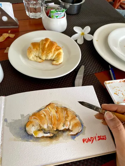 A quick sketch of a croissant before I gobble it up. Done in my travel sketchbook, this watercolor is a memory from my trip to Pondicherry.