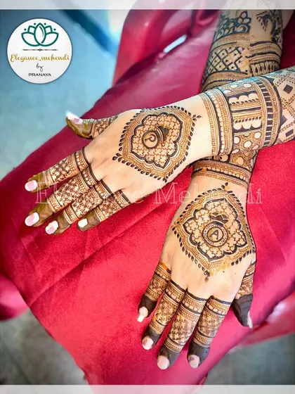 Another example of a customized engagement mehendi, with the groom's initial 'A' beautifully placed within a central mandala design.