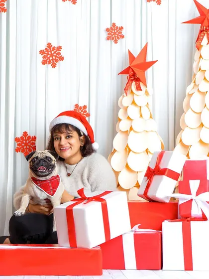 This adorable pug is ready for his close-up! Capturing the unique and charming personalities of every dog is the best part of these holiday sessions.