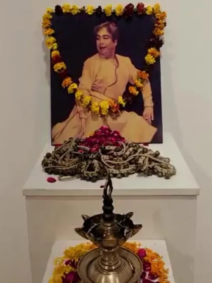 A sacred lamp and ghungroos offered at the portrait of Pt. Birju Maharaj ji on his first 'punyatithi'. His light continues to guide our path.
