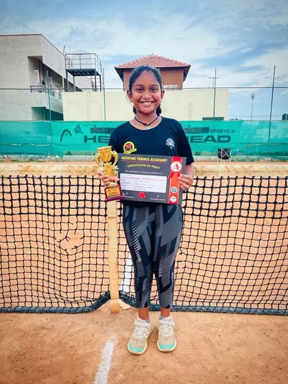 Eshitha posing with her runner-up trophy.