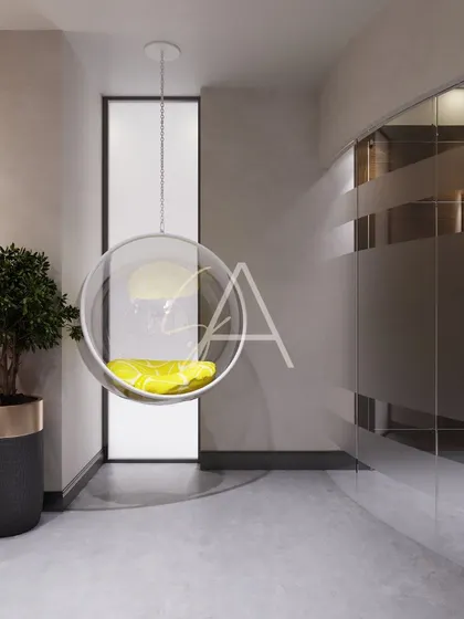 A quiet corner in the office featuring a modern bubble swing chair. We create these small nooks for employees to decompress or think, adding a touch of fun and comfort to the corporate environment.