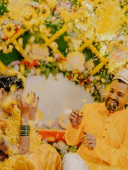 A playful flower fight between the bride and groom during their Haldi. These fun, action-filled shots bring a sense of energy and spontaneity to the wedding album.