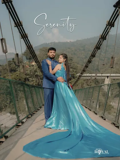 A fairytale moment on one of Rishikesh's iconic suspension bridges. The bride's flowing aquamarine gown contrasts beautifully with the rugged mountains, creating a truly breathtaking portrait that feels both grand and intimate.