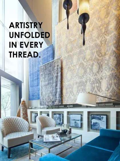 The double-height 'showstopper' display at the Hands Carpets showroom in New Delhi. We designed the space to elevate carpets to the stature of art, using dramatic scale and lighting to create a curated gallery experience for customers.