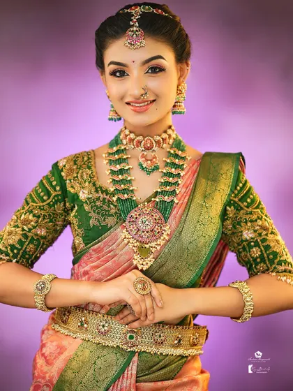 This look, created for a portfolio shoot, showcases a beautiful harmony of pink and green tones in the saree, makeup, and jewelry.