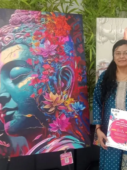 Standing proudly with my vibrant, floral Buddha painting at the India International Art Annual Exhibition. This piece combines two of my favorite subjects, spirituality and nature, and features 3D elements for a unique texture.