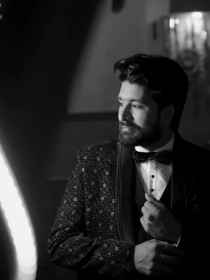 A creative portrait of a guest using lighting effects. This black and white shot has a classic, cinematic feel that we love to create.