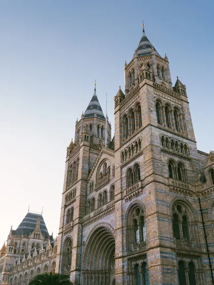 The iconic exterior of the Natural History Museum in London. Choosing a venue with this kind of architectural grandeur gives us an incredible canvas to work with for lighting and production design.