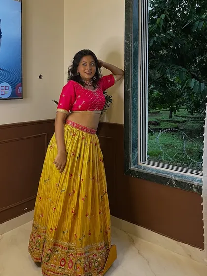 This yellow and pink chanya choli is a classic combination for Navratri. It's bright, festive, and looks great on everyone.
