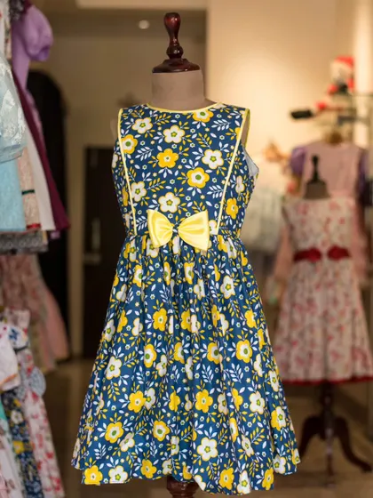 Another look at the navy and yellow floral dress, perfect for showcasing its vibrant colors and playful design.