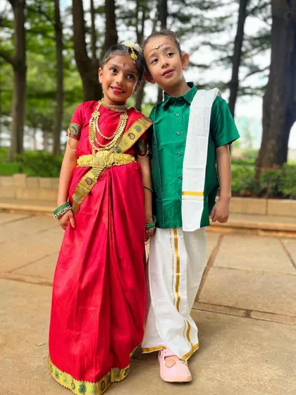 A picture-perfect moment. These two little ones pose together, representing the beautiful cultural celebrations we have at our studio.