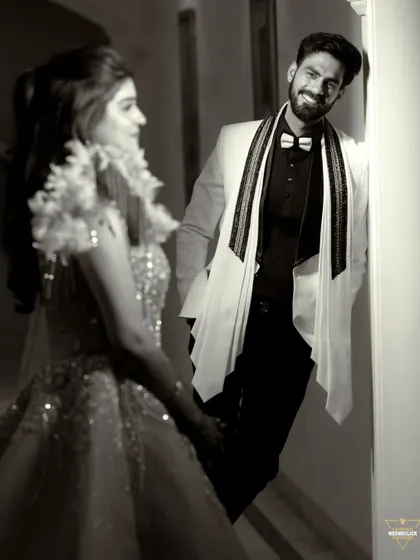 A candid moment captured in black and white. His smiling expression as he looks at her creates a warm and genuine portrait. This shot shows how I focus on capturing the groom's reactions and emotions too.