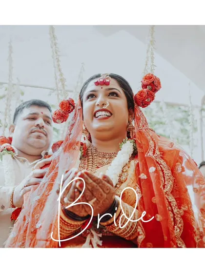A beautiful portrait of the bride, her face lit with pure joy and happiness during a wedding ritual.