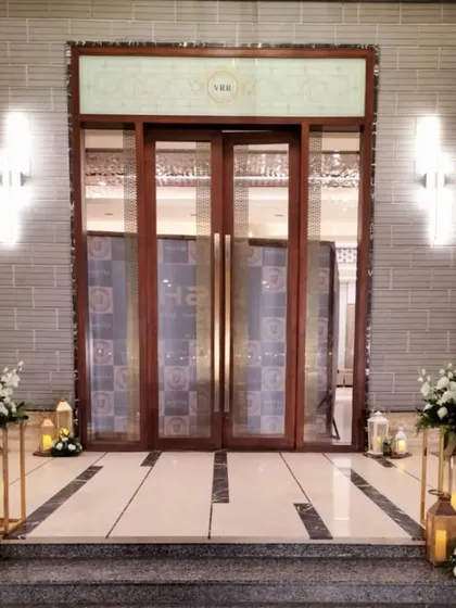 The entrance to the VRR Convention center, elegantly decorated with simple floral arrangements and lanterns, showing how we enhance existing architecture.