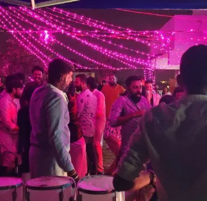 A corporate Diwali party with beautiful pink lighting and a happy crowd. I love creating a festive and celebratory mood for holiday events.