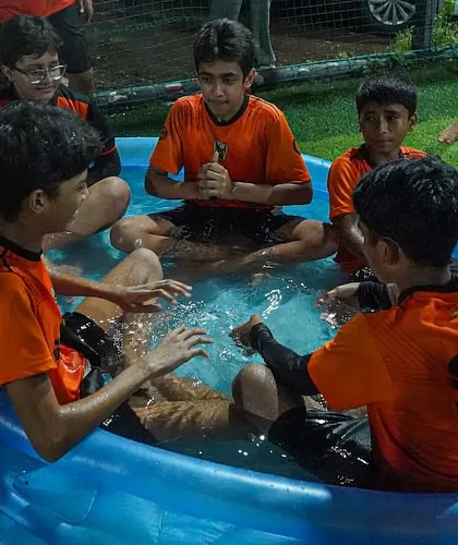 Players relaxing and having fun during an ice bath recovery session. A happy player is a healthy player.