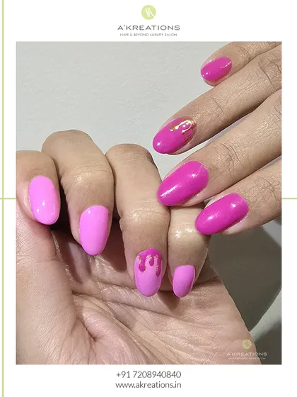 A close-up of the pink drip accent nail. This technique adds a touch of creative flair to a classic solid-color manicure, making it unique and eye-catching.