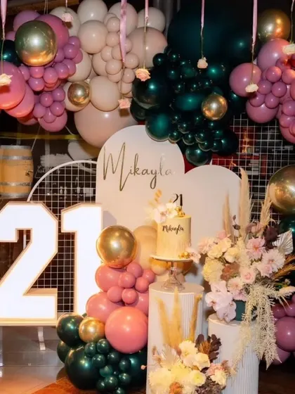 A closer look at the personalized backdrop for the 21st birthday, with the name 'Mikayla' in elegant script.