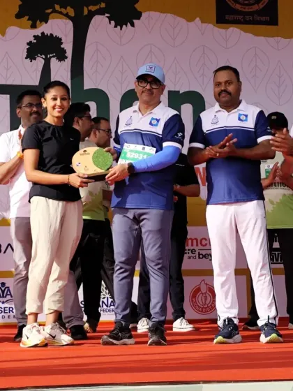 Receiving my award for a second-place overall finish in a hilly half marathon. I am addicted to the process of showing up and staying consistent.