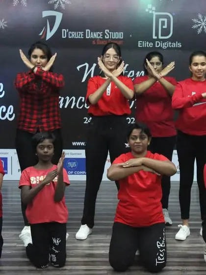 A group of our female students in a powerful pose during a Christmas-themed performance.