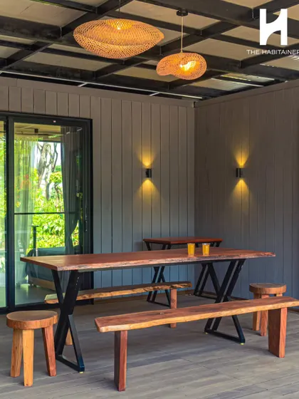 We create inviting communal areas that enhance the guest experience. This rustic-chic outdoor dining space is part of a multi-unit container project in Coorg, designed for guests to gather and enjoy the serene surroundings.