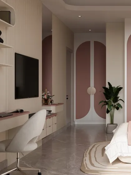 This view showcases the room's elegant flow, from the integrated study and media unit to the beautifully arched wardrobe doors in blush pink. The design uses curves and soft colors to create a gentle, feminine energy.