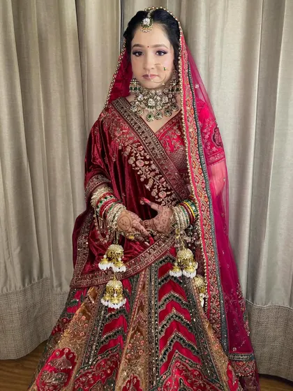 My bride Komal, looking absolutely radiant. I used soft purple and pink tones on her eyes to complement her beautiful velvet lehenga.