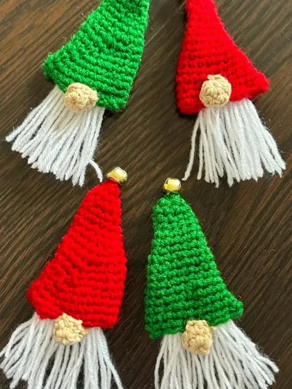 These cute gnome brooches, in festive red and green with fluffy white beards, are a quirky and fun accessory for the Christmas season.