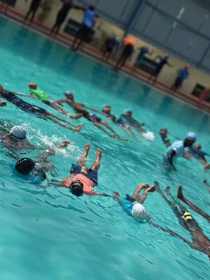 This angled shot shows the unique circular formation of our group Aqua Yoga class. This setup fosters a sense of community and connection among participants as they move together.