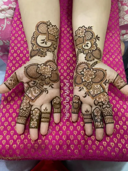 A modern floral design with a unique heart-shaped layout, perfect for an engagement or anniversary.