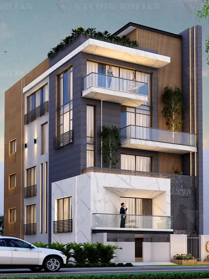 For this 200 sq. yard plot in Patel Nagar, we designed a facade that combines white marble, dark stone, and wood-look panels. The varied materials and projecting balconies create a rich and textured exterior.