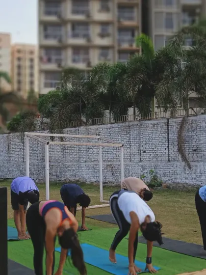 A forward fold during our outdoor morning session. Stretching in the fresh air is a great way to start the day.