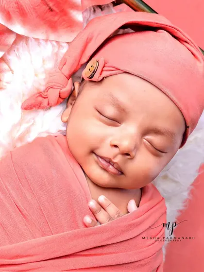 A beautiful, gentle smile from a sleeping baby.