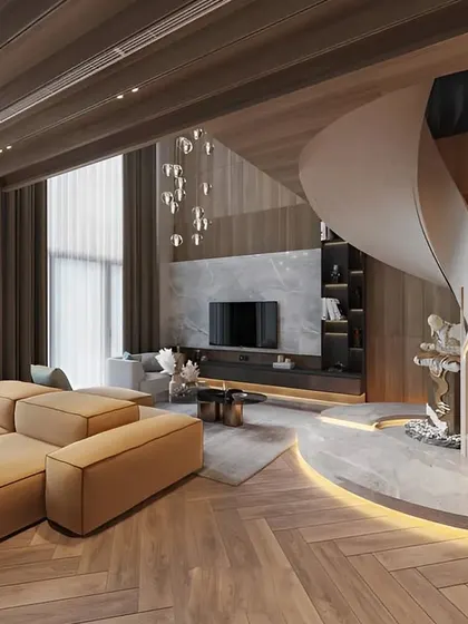 We design for grand spaces, as seen in this luxurious villa living room. The entertainment unit is seamlessly integrated into a large feature wall, complemented by a stunning spiral staircase with illuminated steps.