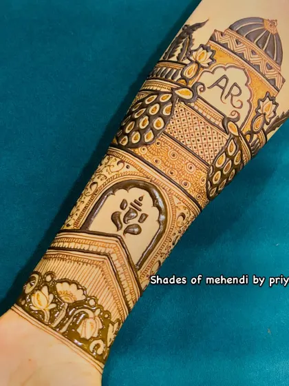 Another example of a Ganesha motif integrated into a detailed arm design. The clean lines and placement make it a beautiful focal point.