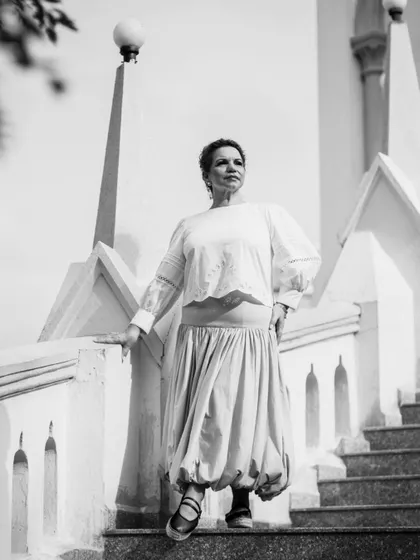 A powerful, low-angle shot in black and white on the steps of the church. This perspective adds a sense of strength and confidence.