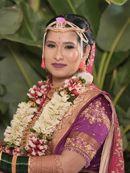 A delightful experience glamming up Gopika for her big day. This look features a bold purple lip and defined eyes, perfect for her vibrant wedding attire.