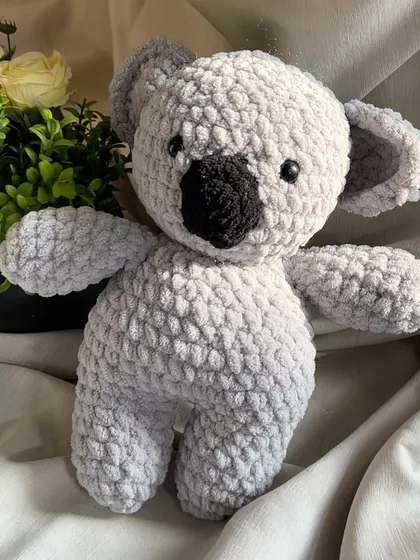 A sweet and cuddly crochet koala. We used a lovely grey chunky yarn to give it a realistic and super soft feel. Its big nose and ears are just waiting for a hug.