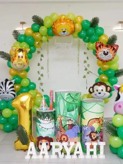 Let's get wild for your little one's first birthday with a fun jungle safari theme. This setup includes a balloon arch with animal foil balloons, jungle-themed props and cake stands, a large "1" foil balloon, and personalized name blocks.