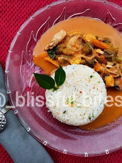 A beautifully presented plate of my Thai Red Curry and rice. I offer this popular dish in both vegetarian and non-vegetarian versions to suit your preference.
