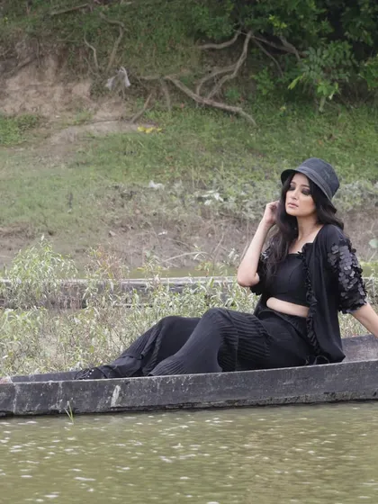 From my "Escape the ordinary" series, this was a conceptual shoot on the water. The styling, including the dramatic black hat, was designed to create a sense of mystery and connection with nature.