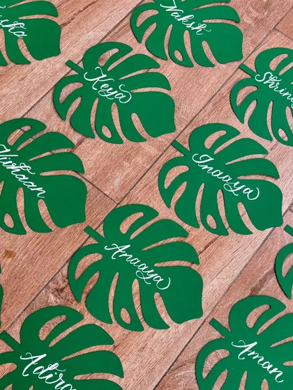 I absolutely loved creating these unique monstera leaf name tags for birthday party favors. The leaves were laser-cut from green cardstock, and I added each name in modern white calligraphy.